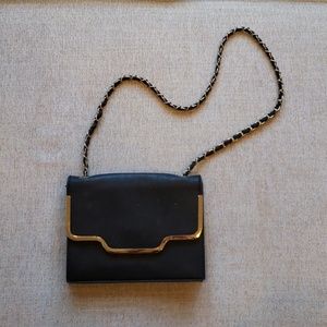 Black purse with gold chain